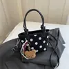 Bolso tipo cubo informal de moda para el día a día, diseño de lunares transfronterizo 2026, un artículo popular para otoño e invierno