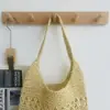 Bolso de paja de un solo hombro floral hueco tejido a mano, nuevo bolso tote tejido de gran capacidad, bolso de playa para vacaciones, bolso versátil para mujer