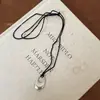 Collar con colgante geométrico ovalado de cordón de cuero estilo coreano, cadena para suéter elegante de nicho de alta gama, collar vintage de lujo ligero para mujer