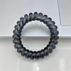 Elegante anillo de pelo de línea telefónica transparente de color claro para viento frío negro ins alto valor de color no daña el pelo cuerda para el pelo sin costuras
