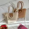 Bolso nuevo tejido bandolera bolso de mano simple cubo bolso de paja bandolera vacaciones Tailandia bolsa de mano de cuerda de algodón