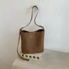 Bolso tejido de patrón vintage para mujer 2026 nuevo otoño de alta gama para ir al trabajo bandolera bajo el brazo bolso cruzado tipo cubo