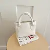 Bolso de mano de lujo ligero estilo francés al por mayor para mujer, nuevo bolso de hombro simple y elegante para el verano de 2026, bolso cruzado para el día a día