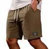 2026 Amazon Nuevos Pantalones Cortos Bermuda Casuales de Color Sólido Ajuste Holgado para Hombre de Algodón y Lino con Cordón Pantalones Cortos de Playa