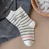 Calcetines de Mujer Otoño e Invierno Calcetines de Algodón Patrón de Cachorro de Dibujos Animados Calcetines a Media Pantorrilla Rayados en Blanco y Negro Calcetines Versátiles Lindos para Mujer Venta al por Mayor