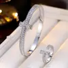 Conjunto de pulsera abierta con incrustaciones de circonita en forma de T y anillo para comercio exterior transfronterizo, joyería versátil de moda simple de alta gama más vendida