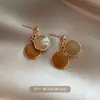 Pendientes de perlas con circonita cúbica brillante y fuegos artificiales rojos con temática de otoño e invierno, un diseño nuevo único y deslumbrante para mujer en 2026