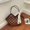 Bolso de hombro tipo tote de gran capacidad con lunares para mujer Shuai Mi Jia, nuevo modelo de moda para principios de otoño de 2026, para el trabajo y el transporte