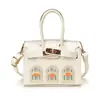 Mini bolsa infantil transfronteiriça, estilo coreano, fofa, moderna, de alta qualidade, nicho e bolsa leve de luxo estilo Kelly para meninas