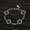 Pulsera Cruzada de Hip-Hop Europeo y Americano de Acero Inoxidable con Trébol de Cuatro Hojas para Mujer Cadena en Forma de O Joyería de Acero de Titanio Joyería de Diseño de Nicho Personalización de Joyería