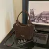 Bolso pequeño súper popular para el trabajo, nuevo bolso de hombro vintage con estampado de leopardo para mujer 2026, bolso cruzado tipo cubo