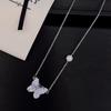Traje de Mariposa de Cristal Azul de Alto Sentido Francés Perla de Agua Dulce Pendientes Collar Anillo de Temperamento Viento Frío Estilo Princesa