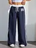 Atacado de calças casuais femininas estampadas da moda estilo americano, de cintura alta, para primavera e outono, com color blocking esportivo e design de perna reta
