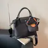Bolsa de ombro transversal feminina transfronteiriça de grande capacidade, nova moda outono 2026, versátil, bolsa tote para escola e trabalho