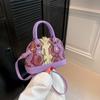 Bolsa de concha portátil da moda para mulheres 2023 Verão novo padrão de cor contrastante ombro único transversal casual simples bolsa para o dia a dia
