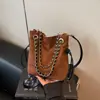 Bolso tote de gran capacidad transfronterizo, bolso de hombro único con cadena de moda, bolso tipo cubo retro de comercio exterior, bolso cruzado casual, bolso para mujer