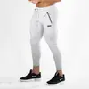 Otoño e invierno Europa y Estados Unidos transfronterizo nuevos pantalones fitness ocio running deportes entrenamiento hombres pie pequeño pantalones ajustados