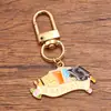 Varios accesorios de joyería de aleación personalizados transfronterizos europeos y americanos para la temporada de graduación, incluyendo encantadores colgantes de birrete, flores y exámenes.