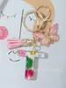 Suministros del Fabricante Llaveros con Flores Secas Prensadas 26 Letras del Alfabeto Inglés Llaveros con Borla de Mariposa Charms para Bolsos de Mujer
