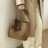 Bolso tipo cubo de gama alta para mujer 2026 nuevo diseño de moda gran capacidad bolsa para el día a día bolso de mano retro de un solo hombro cruzado