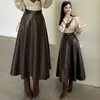 Falda midi de piel para mujer 2026 nuevo estilo otoño e invierno, de cintura alta, falda larga con bolsillos, que cubre la cadera y efecto adelgazante
