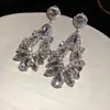 Brincos de Borla Gota de Água Geométrica Vazada com Diamantes Incrustados em Agulha de Prata Brincos Estilo Palácio Europeu e Americano Transfronteiriço Brincos de Luxo Leve e High-End