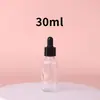 Botella cuentagotas de vidrio transparente Xinmei para aceites esenciales, botella vacía para sérum, admite proceso personalizado de pulverización y estampado en caliente