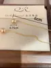 Pendientes de Perla Color Champagne Elegantes Cálidos Gama Alta Sencillos de Moda Combinan con Todo Pendientes de Otoño e Invierno Nuevas Explosiones de Pendientes para Mujer