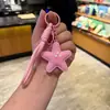 Nuevo Llavero Creativo de Imitación de Cuero con Forma de Estrella de Cinco Puntas y Colgante de Cuerda Tejida, Decoración para Mochila de Estudiante, Pequeño Juguete de Regalo