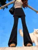 Calça Harem Micro Flare Preta Feminina Outono 2026 Novo Estilo Coreano Calça Saia Camada Falsa de Duas Peças Calça Flare Mochi Petite