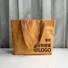 Bolsa de Papel DuPont en stock Bolso de Mano de Papel Kraft Lavado Logo Imprimible Resistente al Agua y a las Lágrimas Retro Cruzado Bolsa de Papel DuPont