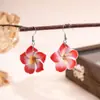 Europa y Estados Unidos estilo de vacaciones de playa transfronterizo nuevo pendientes de flor de huevo de arcilla blanda dopamina pendientes elegantes para mujer