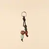 Colgante de Bolsa con Cuentas de Cerámica de Colores Tejido a Mano Piedra Cuentas de Madera Colgante de Bolsa Longxiang Accesorios de Llavero de Moda
