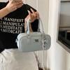 Bolso de bolos de alta gama de color liso para mujer, bolso cruzado de moda 2025, bolso de almohada portátil informal de nicho.