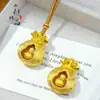 Tienda de Oro Mismo Estilo Oro Antiguo Incrustado con Diamantes Cepillado Calabaza Giratoria Bolsa de la Suerte Colgante Nuevo Chino Versátil Colgante de Bolsa de la Suerte