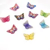 Nuevos accesorios de mariposa de color de impresión bronceado de resina DIY, accesorios de aretes coreanos, parche de pegamento de gota para funda de teléfono móvil