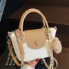 Bolso de Mano de Nueva Moda Primavera y Verano con Textura de Lichi, Femenino, Versátil y Estilo Occidental para Viajes Cruzado