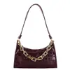 Bolsa de mano tipo dumpling de alta calidad al por mayor para mujer, nuevo modelo otoño 2026, bolso de hombro de color liso con patrón de cocodrilo, bolso de axila de moda