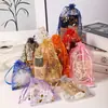 Al por mayor en stock Bolsa de Gasa con Estampado en Caliente Flor Bauhinia Bolsa para Empaquetar Dulces de Boda Huevos de Pascua Bolsita con Cordón para Joyería Bolsa de Regalo