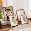 Decoración de marco de fotos de madera al por mayor 6 pulgadas 8 pulgadas grano de madera simple creativo foto padre-hijo foto de viaje decoración marco de fotos decoración
