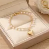Pulsera apilable de perlas de estilo nuevo de lujo nicho coreana y japonesa con colgante de corazón de moda retro versátil pulsera de doble capa