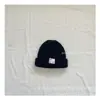 Versión coreana de gorro de punto simple estándar pequeño para niños de invierno, gorro cálido, gorro de lana para bebé, gorro para el frío, venta al por mayor