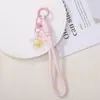 Alça de celular flor de resina transparente oca, cordão trançado, pulseira de pulso com pingente de flor fofa, fornecimento atacadista de acessórios