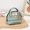Mini bolso de concha de celebridad de internet llavero bolso de mano monedero colgante de bolsa portátil para guardar labial auriculares bolsa pequeña