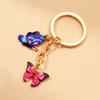 Llavero de aleación con forma de mariposa y abeja, accesorio colgante para bolso de mujer, ideal como regalo de vacaciones para niñas.