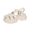 Sandalias romanas Baotou para mujer, nuevo estilo de verano 2023, sandalias tejidas estilo jaula con suelas gruesas, diseño de una sola tira y sandalias de playa ahuecadas