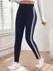 Pantalones de yoga de estilo europeo y americano con rayas laterales de cintura alta para mujer, leggings deportivos finos de primavera/verano para correr, adecuados para uso en exteriores, leggings ajustados de nueve puntos.