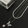 Collar de perlas con costura de mariposa de cristal para mujer, estilo nicho, ligero, de lujo, estilo Y2K, para chicas atractivas, doble capa, accesorios superpuestos, cadena de clavícula dulce y genial.