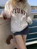 Roupas Femininas Outono 2025 Nova Moda Redutora de Idade Moletom com Estampa de Letras Americanas Manga Longa Jaqueta com Capuz Primavera