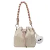Bolso de paja tejido para mujer 2026 nuevo diseño de nicho bolso cruzado primavera/verano para vacaciones en la playa bolso tipo cubo de playa